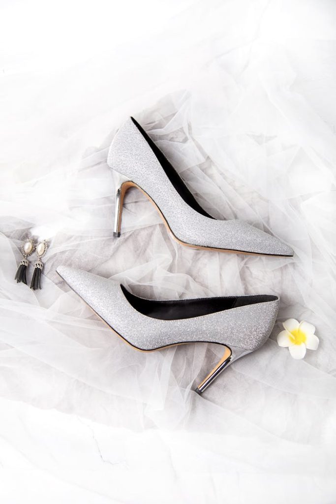 pexels photo 3602449 2 Chic and stylish silver high heels paired with elegant earrings, perfect for formal wear.